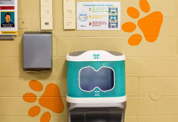 30e Scientific's aqueous ozone hand-rinsing station has been installed in at least three Cobb County elementary schools. The stations, which cost $14,361 apiece, use ozone to remove germs from a person's hands. Credit: Jenni Girtman for The Atlanta Journal-Constitution.