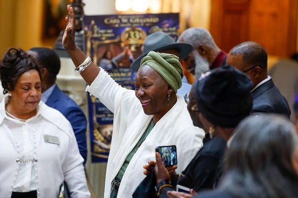 Pat Gilliard Gunn, an ancestor of William Golden, one of the first Black legislators, cheers at an event honoring “The Original 33” at the Capitol on Wednesday, Feb. 25, 2026. (Arvin Temkar/AJC)