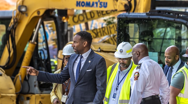 Atlanta, Mayor Andre Dickens said Monday that he took criticism from the public "to heart." Crews are continuing to work on a broken main on West Peachtree Street in Midtown, with nearby residents warned of impacts to their water service as the crisis reached its fourth day Monday, June 3, 2024. Water had been gushing out of the broken main until Monday morning, when workers were seen pumping out water. (John Spink/AJC)