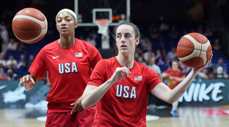 Angel Reese, of the United States, left, and United States' Caitlin Clark warm up for the Women's Basketball World Cup quarterfinal match between the United States and Hungary in Berlin, Thursday, Sept. 10, 2026. (AP Photo/Ebrahim Noroozi)