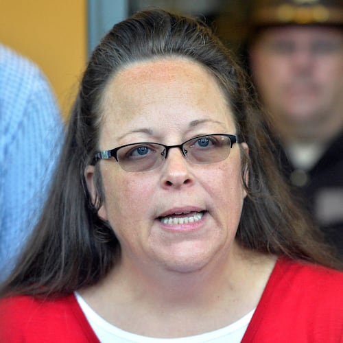 FILE - Rowan County Clerk Kim Davis makes a statement to the media at the front door of the Rowan County Judicial Center in Morehead, Ky. Sept. 14, 2015. (AP Photo/Timothy D. Easley, File)