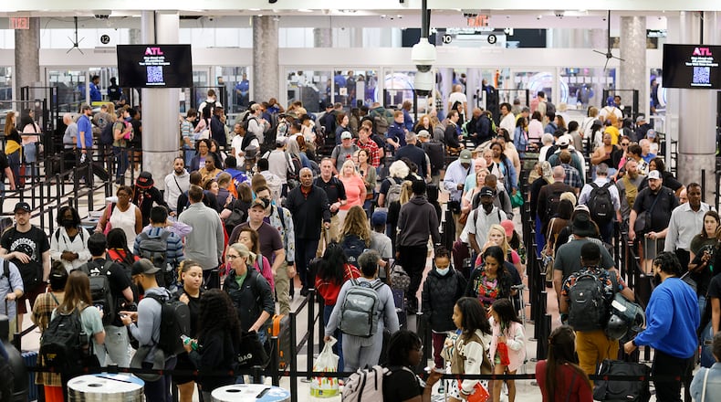 Passengers move through TSA security lines at the main security checkpoint area at the Hartsfield-Jackson Atlanta International Airport on Monday, May 22, 2023. 
Miguel Martinez /miguel.martinezjimenez@ajc.com
