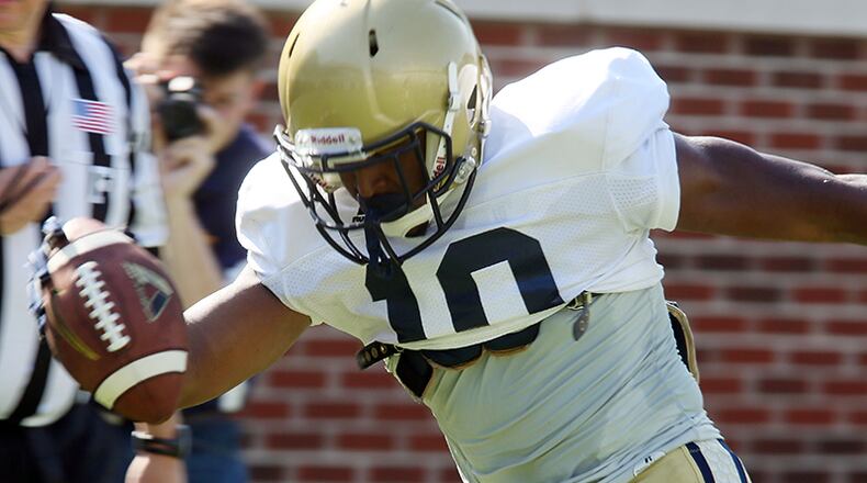 Former quarterback Synjyn Days, ho ran for a score in Saturday's scrimmage, is still in running for A-back position.