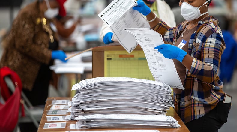 Dekalb election workers sort presidential ballots in Stonecrest Saturday, November 14, 2020..  STEVE SCHAEFER / SPECIAL TO THE AJC