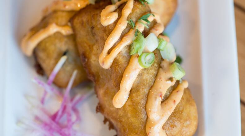 Hopstix Sushi Corndog with beer-battered fried spicy tuna roll, and spicy mayo. Photo credit- Mia Yakel.