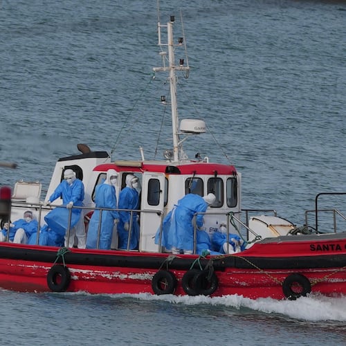 Health workers in protective gear arrive to evacuate patients from the MV Hondius cruise ship at a port in Praia, Cape Verde, Wednesday, May 6, 2026. (AP Photo/Misper Apawu)