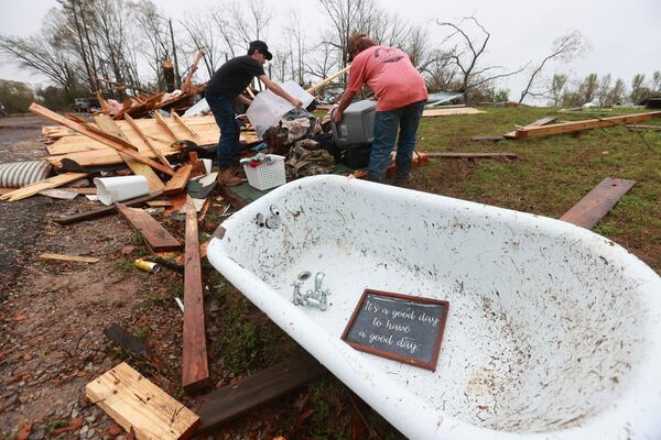A piece of home decor rests inside a claw foot bathtub that was thrown from it's house along Tippah County Rd. 122 in the Three Forks Community near Walnut Miss., Thursday, April 3, 2025. (Thomas Wells /The Northeast Mississippi Daily Journal via AP)
