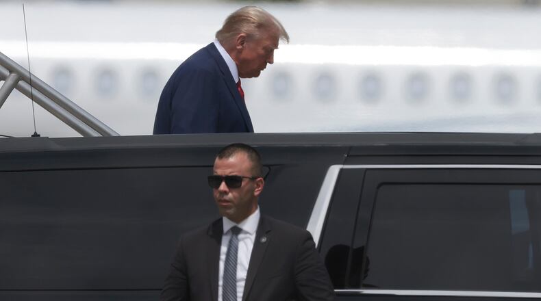 Republican presidential candidate former U.S. President Donald Trump arrives at the Miami International Airport June 12, 2023, in Miami, Florida. Trump is scheduled to appear Tuesday in federal court for his arraignment on charges including possession of national security documents after leaving office, obstruction, and making false statements. (Win McNamee/Getty Images/TNS)