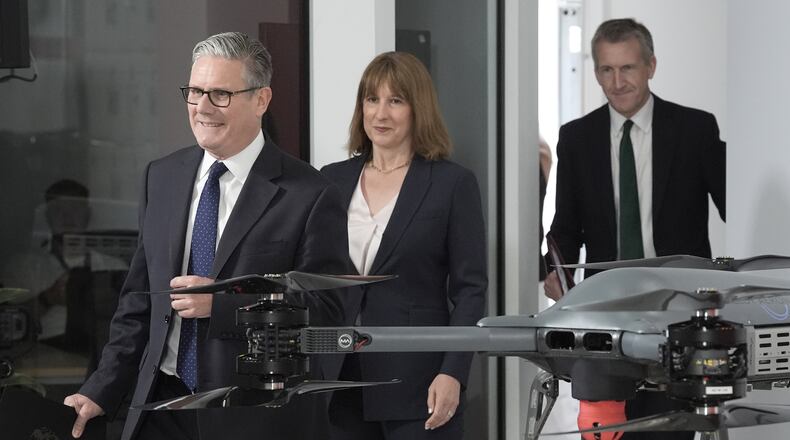 British Prime Minister Keir Starmer, left, followed by Chancellor of the Exchequer Rachel Reeves and Defense Secretary Dan Jarvis arrive for the announcement of a defense plan, in Berkshire, England, Tuesday, June 30, 2026. (Stefan Rousseau/Pool Photo via AP)