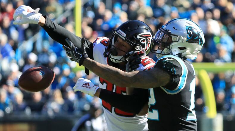 Falcons cornerback Isaiah Oliver breaks up a pass to Panthers wide receiver D.J. Moore Sunday, Nov. 19, 2019, at Bank of America Stadium in Charlotte.
