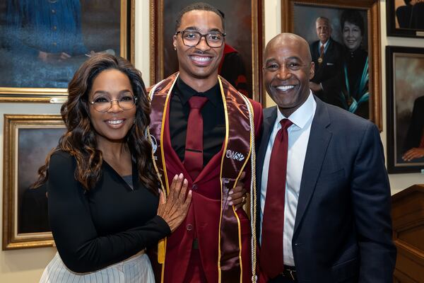 Morehouse College senior Marcellis McQueen, a recipient of the Oprah Winfrey Scholarship, stands with Winfrey and college president F. DuBois Bowman during Winfrey's surprise visit on Friday, April 24, 2026. "I was in utter shock," says McQueen of Winfrey's visit. (Courtesy of Morehouse College)
