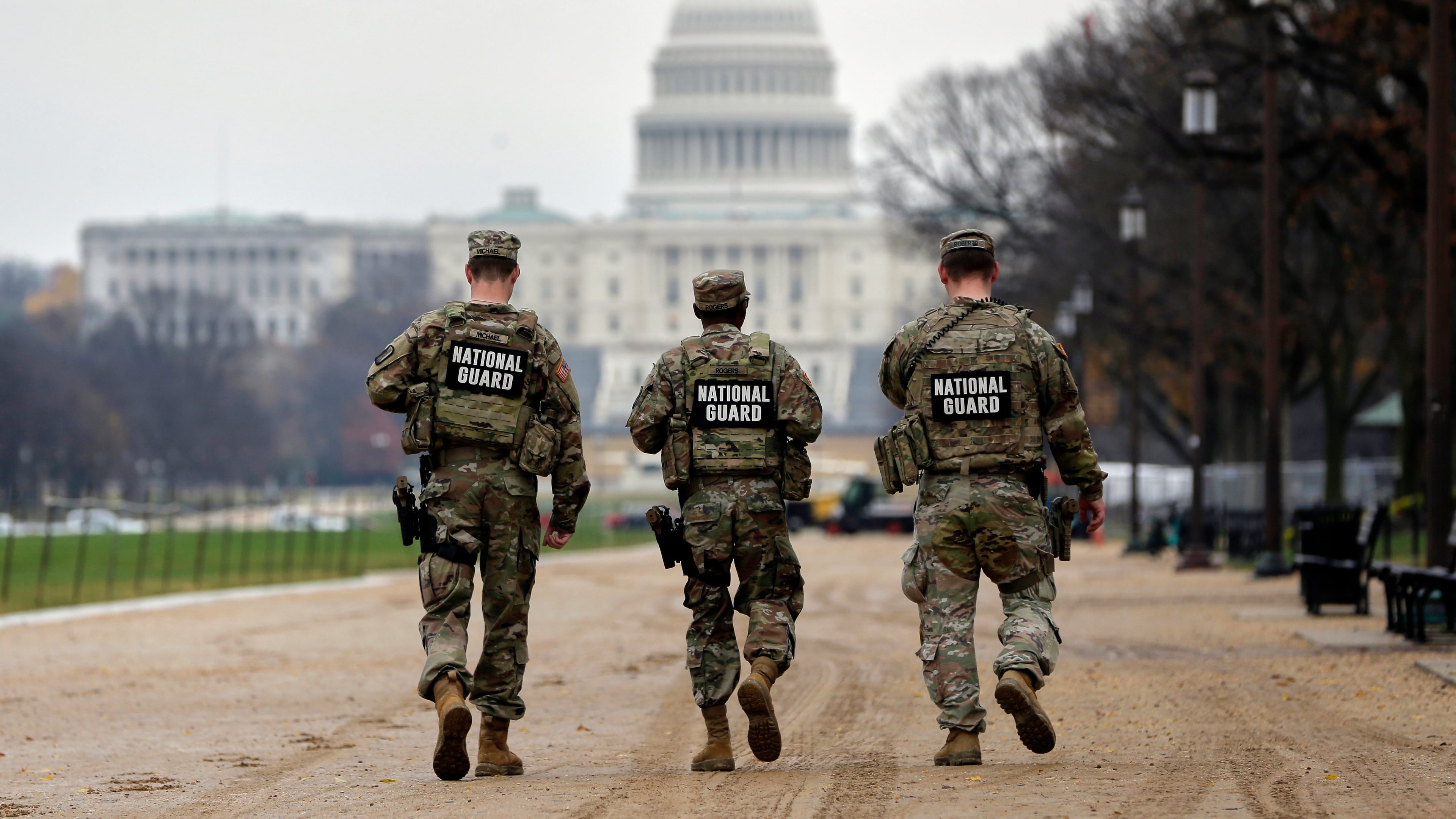 National Guard patrol along the National Mall in front of the Capitol, Wednesday, Nov. 26, 2025, in Washington. (AP Photo/Rahmat Gul)