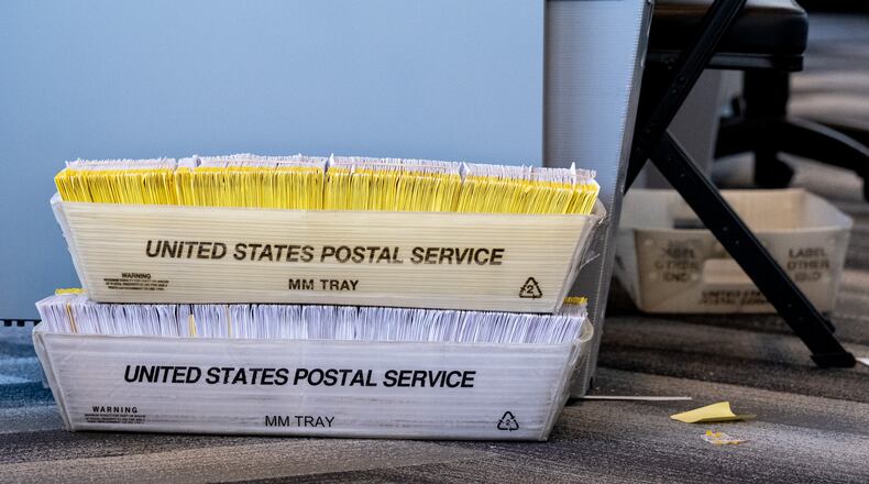201104-Atlanta-Bins of ballots sit on the floor of the Fulton County absentee ballot counting room at State Farm Arena on Wednesday afternoon, Nov. 4, 2020. Ben Gray for the Atlanta Journal-Constitution