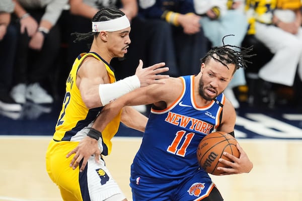 Indiana Pacers guard Andrew Nembhard (2) defends against New York Knicks guard Jalen Brunson (11) during the first half of Game 6 of the Eastern Conference finals of the NBA basketball playoffs in Indianapolis, Saturday, May 31, 2025. (AP Photo/Michael Conroy)