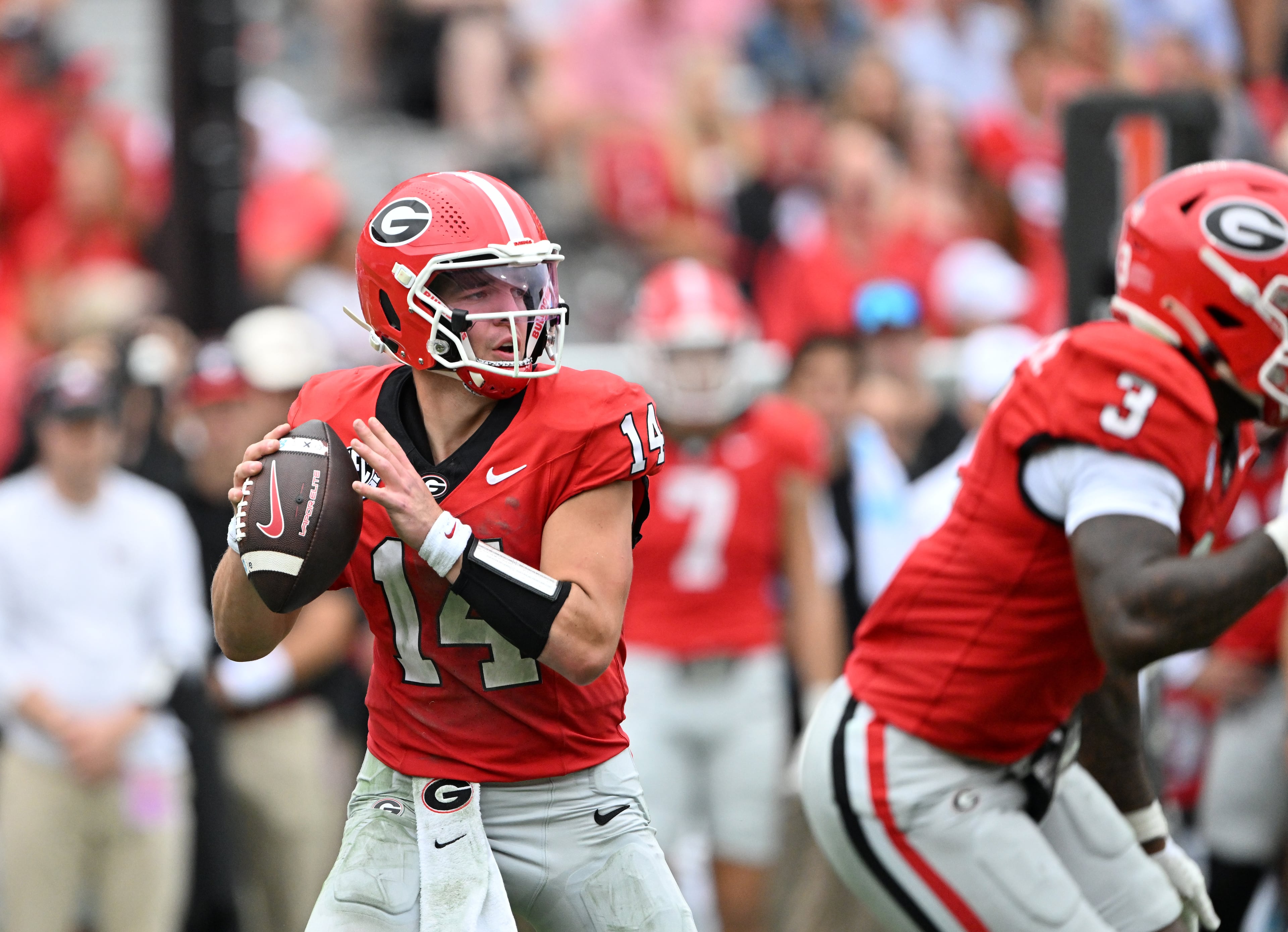 Georgia quarterback Gunner Stockton (14) prepares to get off a pass during the first half in a NCAA college football game at Sanford Stadium, Saturday, October 4, 2025, in Athens. (Hyosub Shin / AJC)
