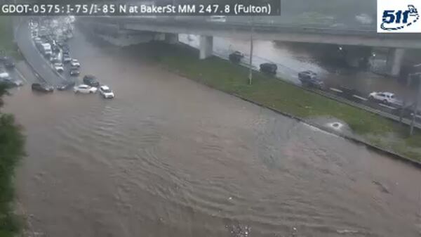 A Georgia Department of Transportation camera shows flash flooding on the Downtown Connector in Atlanta after heavy rain hit the city during rush hour on Wednesday, May 20, 2026. (Courtesy of GDOT)