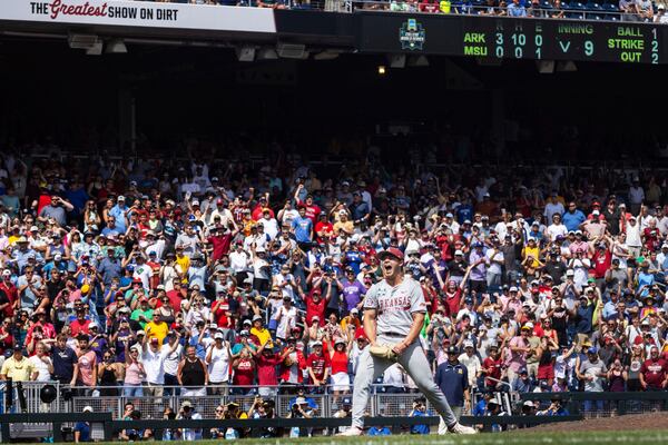 Arkansas pitcher Gage Wood celebrates after striking out Murray State's Jonathan Hogart for a no-hitter and a record 19 strikeouts in an NCAA College World Series baseball game at Charles Schwab Field in Omaha, Neb., Monday, June 16, 2025. (Chris Machian/Omaha World-Herald via AP)