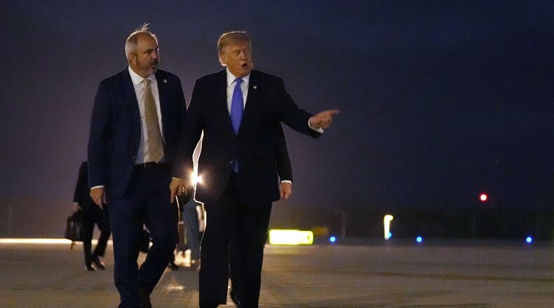 President Donald Trump walks to board Air Force One, Tuesday, Aug. 4, 2026, at Los Angeles International Airport in Los Angeles. (AP Photo/Mark Schiefelbein)