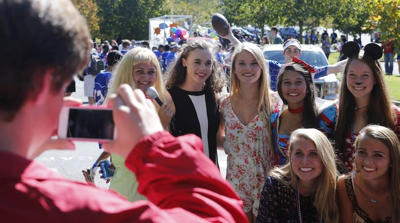 Eris Lovell (second from left) in 2014, photographed with other homecoming parade participants before the parade. Lovell is believed to be the first transgender student named to a high school homecoming court in Georgia.