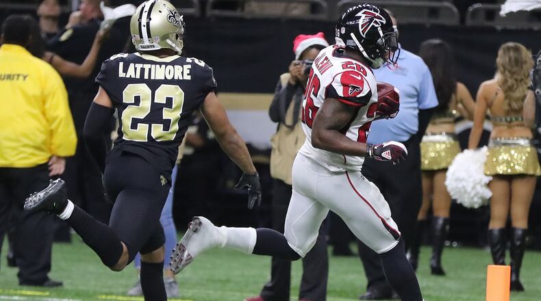 Falcons running back Tevin Coleman scores the Falcons' only touchdown against the Saints during the second half in a NFL football game on Sunday, December 24, 2017, in New Orleans. Curtis Compton/ccompton@ajc.com