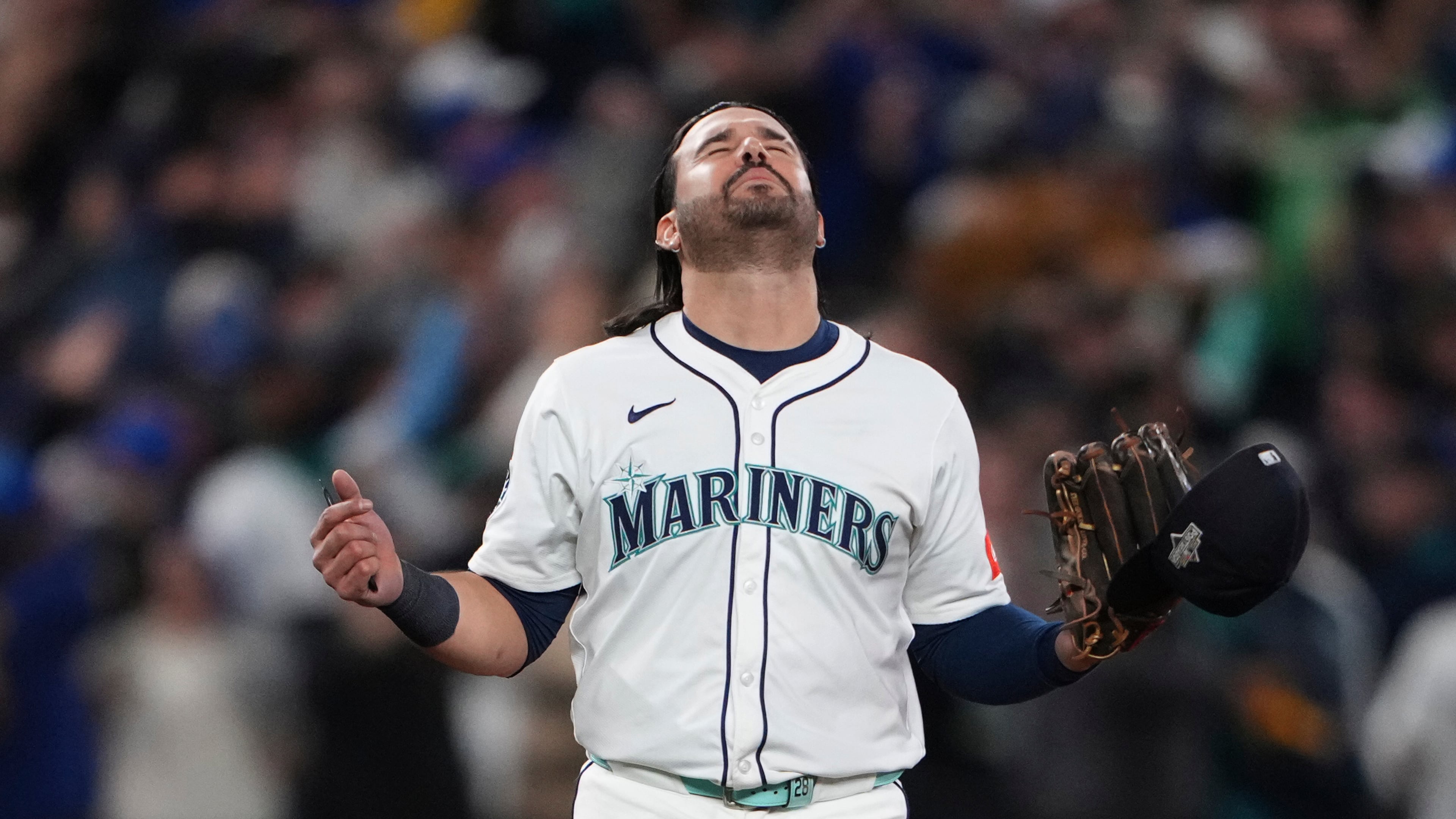 Seattle Mariners' Eugenio Suárez reacts after Game 5 of baseball's American League Championship Series against the Toronto Blue Jays, Friday, Oct. 17, 2025, in Seattle. (AP Photo/Lindsey Wasson)