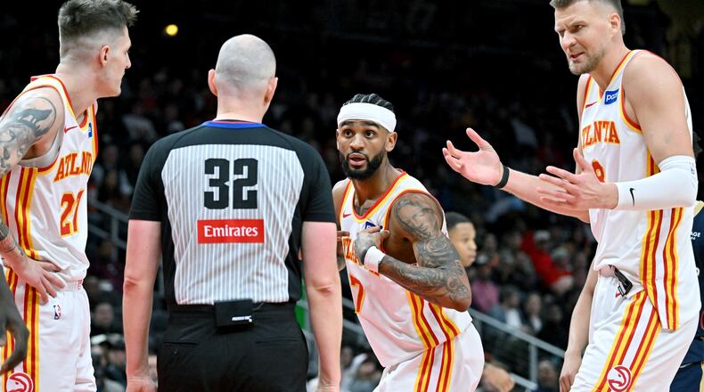 Atlanta Hawks guard Nickeil Alexander-Walker (center) appeals to a referee during the second half of a game against the New Orleans Pelicans at State Farm Arena, Wednesday, Jan. 7, 2026, in Atlanta. (Hyosub Shin/AJC)