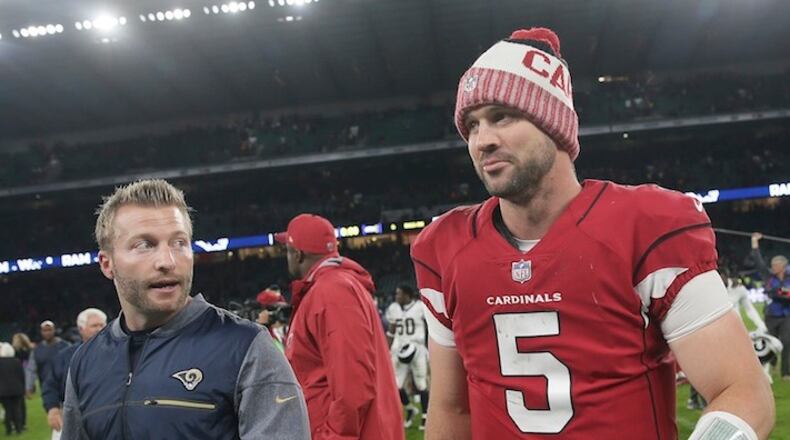 Arizona Cardinals quarterback Drew Stanton (5) leaves the field with Los Angeles Rams head coach Sean McVay after an NFL football game at Twickenham Stadium in London, Sunday Oct. 22, 2017. The Rams won 33-0. (AP Photo/Tim Ireland)