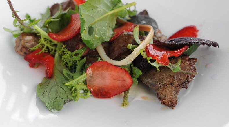 Skillet Chicken Livers with pickled ramps, wild greens, strawberries, brown butter, verjus . (Beckysteinphotography.com)