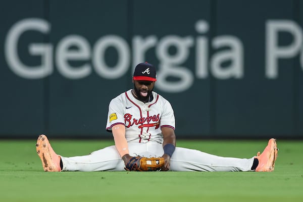 Braves outfielder Michael Harris II reacts after making a sliding ninth-inning catch.