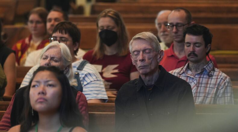 Quakers attend a Sunday worship in the historic West Room of the Arch Street Meeting House in Philadelphia on Oct. 5, 2025. (AP Photo/Luis Andres Henao)