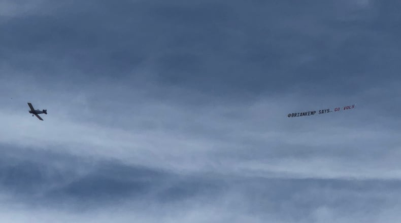 The Democratic Party of Georgia hired a plane to pull this banner that reads “@BrianKemp says ... Go Vols” over Athens before the Bulldogs routed Tennessee on Sept. 29.