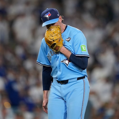 Toronto Blue Jays' pitcher Shane Bieber yells in his glove as he leaves the game during the sixth inning in Game 4 of baseball's World Series against the Los Angeles Dodgers, Tuesday, Oct. 28, 2025, in Los Angeles. (AP Photo/Ashley Landis)