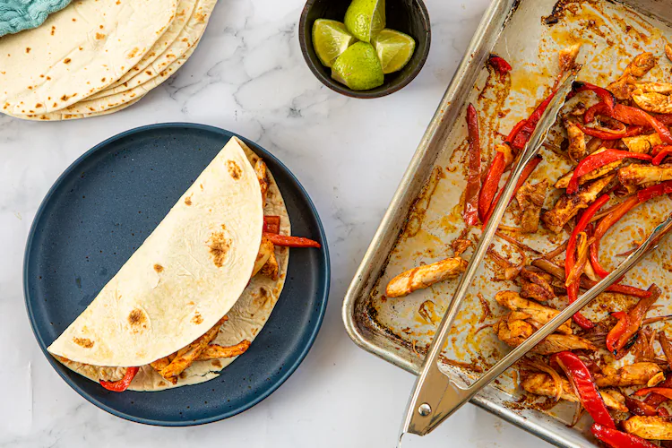 Sheet Pan Chicken Fajitas cook relatively quickly. And this method works particularly well with boneless, skinless chicken thighs. (Aaliyah Man for the AJC/food styling by Kate Williams)
