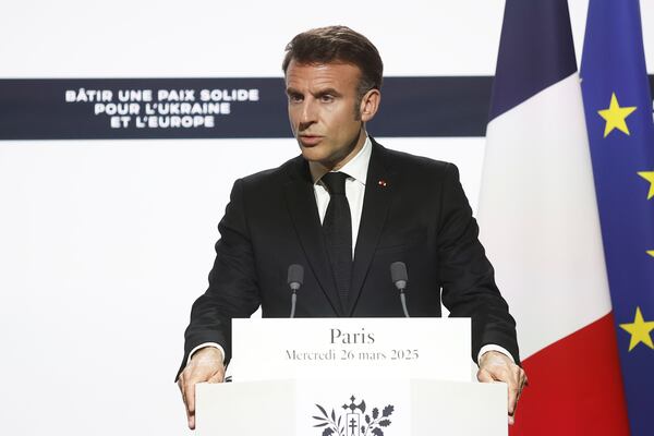 French President Emmanuel Macron gives a press conference with Ukrainian President Volodymyr Zelenskyy following a bilateral meeting at the Elysee Palace in Paris, Wednesday, March 26, 2025. (Yoan Valat, Pool via AP)