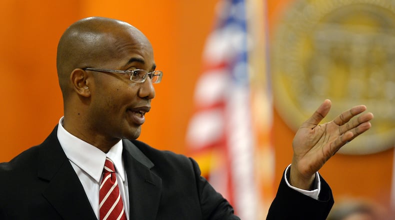 DeKalb County District Attorney Robert James questions potential jurors. Suspended DeKalb County CEO Burrell Ellis appears before Judge Courtney L. Johnson in Dekalb County Superior Court during jury selection Monday, September 8, 2014. Ellis is accused of improperly pressuring county contractors for campaign contributions. KENT D. JOHNSON / KDJOHNSON@AJC.COM