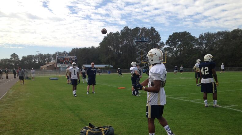 Georgia Tech A-backs Qua Searcy and Clinton Lynch warm up before the Yellow Jackets’ Wednesday practice at Fernandina Beach High in Fernandina Beach, Fla. (AJC photo by Ken Sugiura)