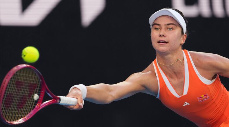 Iva Jovic of the U.S. plays a forehand return to Jasmine Paolini of Italy during their third round match at the Australian Open tennis championship in Melbourne, Australia, Friday, Jan. 23, 2026. (AP Photo/Aaron Favila)