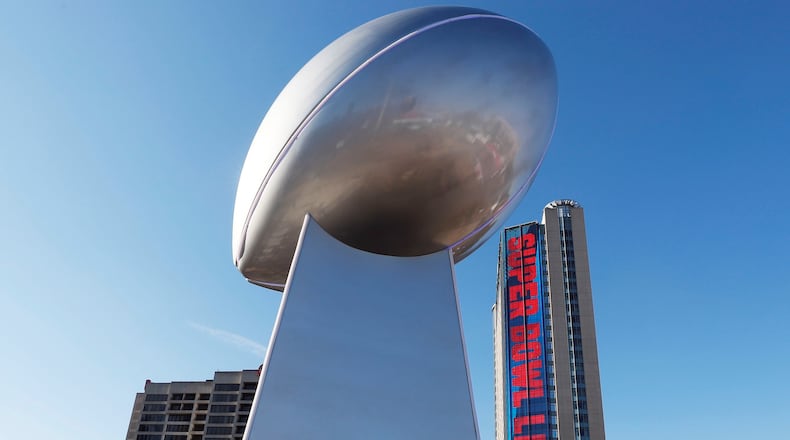 The Lombardi Trophy at Victory Square in Super Bowl Live in Centennial Park is a 35 foot interactive sculpture. Crews work to get Super Bowl LIII's official fan attractions, Super Bowl LIVE presented by Verizon, Super Bowl Experience Driven by Hyundai and NFL Shop at Super Bowl LIII presented by Visa, ready for opening day on Saturday.   Bob Andres / bandres@ajc.com