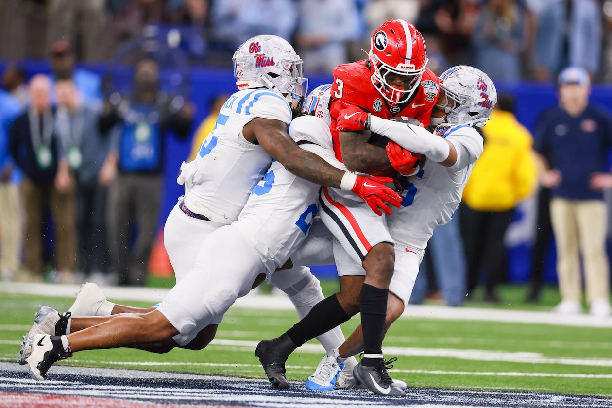 Georgia Bulldogs running back Nate Frazier runs for a first down against the Ole Miss Rebels defense during the fourth quarter of the NCAA College Football Playoff quarterfinal game at the Sugar Bowl in the Caesars Superdome, Thursday, Jan. 1, 2026, in New Orleans. (Jason Getz/AJC)