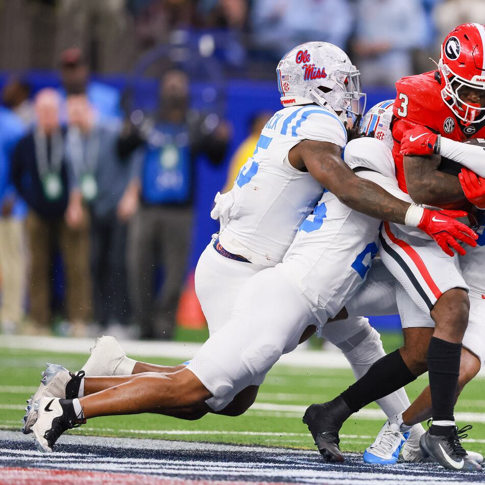 Georgia Bulldogs running back Nate Frazier runs for a first down against the Ole Miss Rebels defense during the fourth quarter of the NCAA College Football Playoff quarterfinal game at the Sugar Bowl in the Caesars Superdome, Thursday, Jan. 1, 2026, in New Orleans. (Jason Getz/AJC)