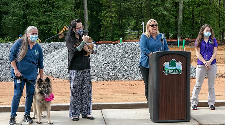 Forsyth County officials preside at groundbreaking ceremonies June 25 for a new dog park across from the county Animal Shelter. FORSYTH COUNTY