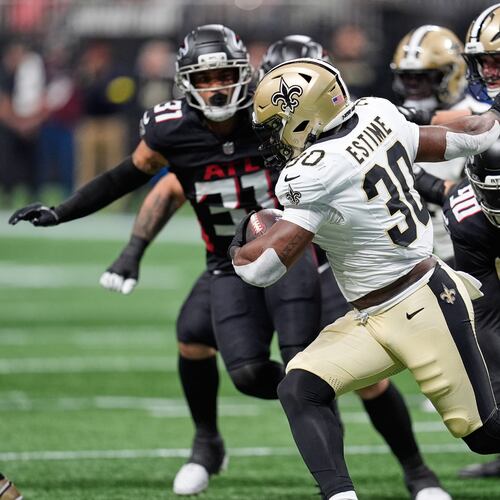 New Orleans Saints running back Audric Estime (30) carries past Atlanta Falcons defensive tackle David Onyemata (90) in the first half of an NFL football game, Sunday, Jan. 4, 2026, in Atlanta. (AP Photo/Mike Stewart)