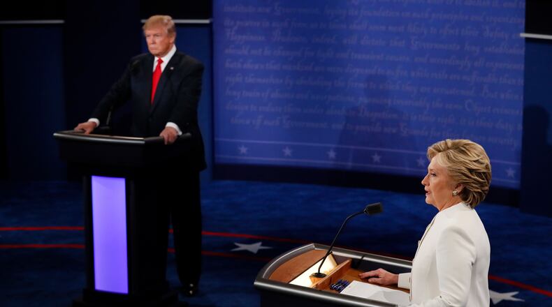 Democratic presidential nominee Hillary Clinton speaks as Republican presidential nominee Donald Trump listens during the third presidential debate at UNLV in Las Vegas, Wednesday, Oct. 19, 2016. (Mark Ralston/Pool via AP)