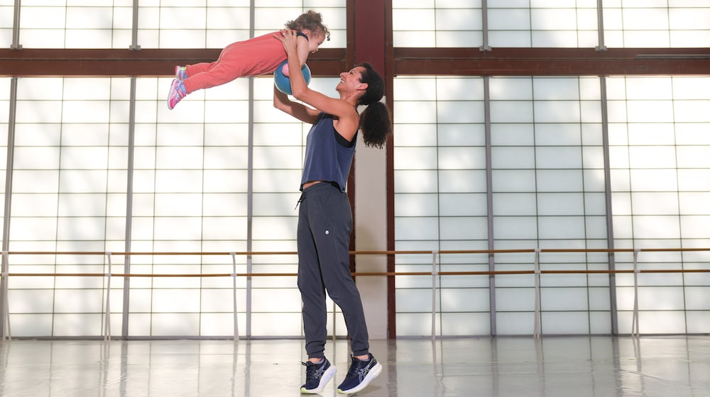Choreographer Claudia Schreier plays with her daughter Hana, 2, at a rehearsal studio at the Atlanta Ballet Michael C. Carlos Dance Centre in Atlanta on Thursday, March 26, 2026. (Arvin Temkar/AJC)