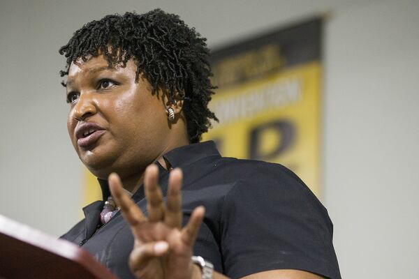 Stacey Abrams speaks to a crowd at a campaign event. The Democratic candidate for governor created two nonprofit foundations that helped to establish her as a major political figure in Georgia. (Alyssa Pointer/AJC)