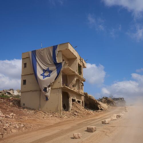 An Israeli flag hangs from a building in an area occupied by Israeli troops in southern Lebanon, Thursday, July 9, 2026. The Israeli military invited reporters on a tour of the strategic mountain topped by the Crusader-built Beaufort Castle months after launching a ground invasion that captured dozens of Lebanese villages and towns in southern Lebanon. (AP Photo/Ohad Zwigenberg)