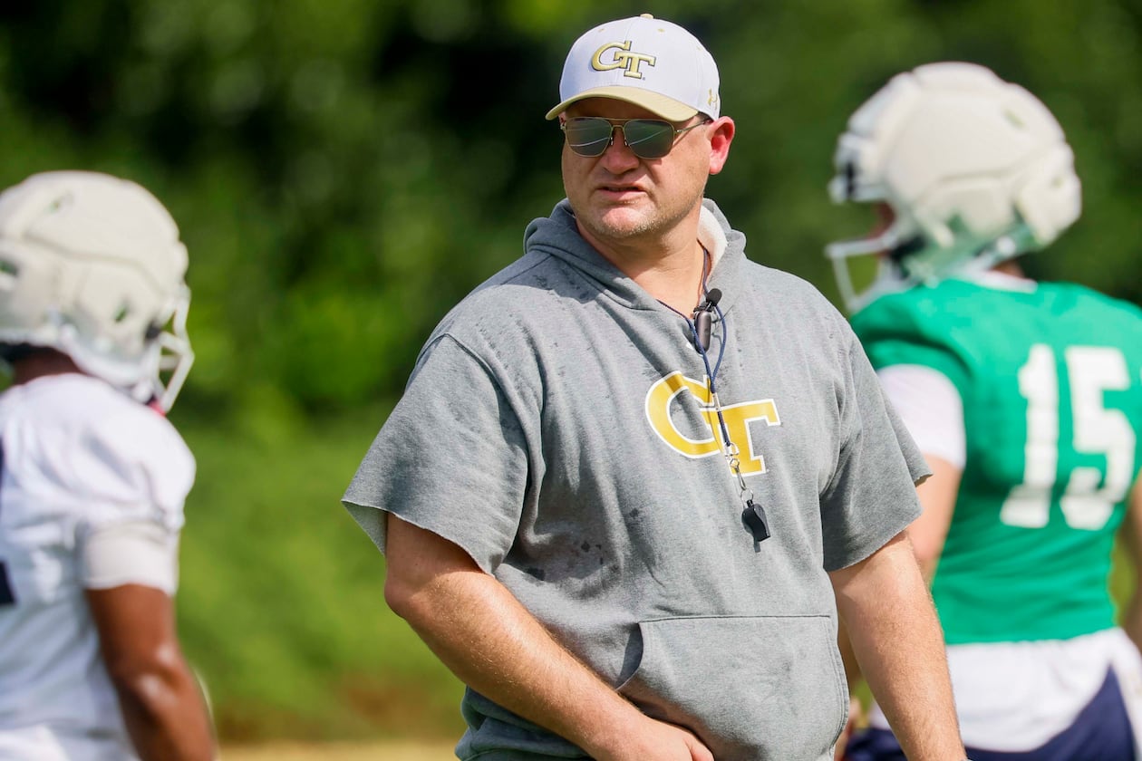 Georgia Tech head coach Brent Key observes the offensive team practicing on the field during the first day of football training at Rose Bowl Field and the Mary and John Brock Football Practice Facility, Monday, August 3, 2026, in Atlanta. (Miguel Martinez/AJC)