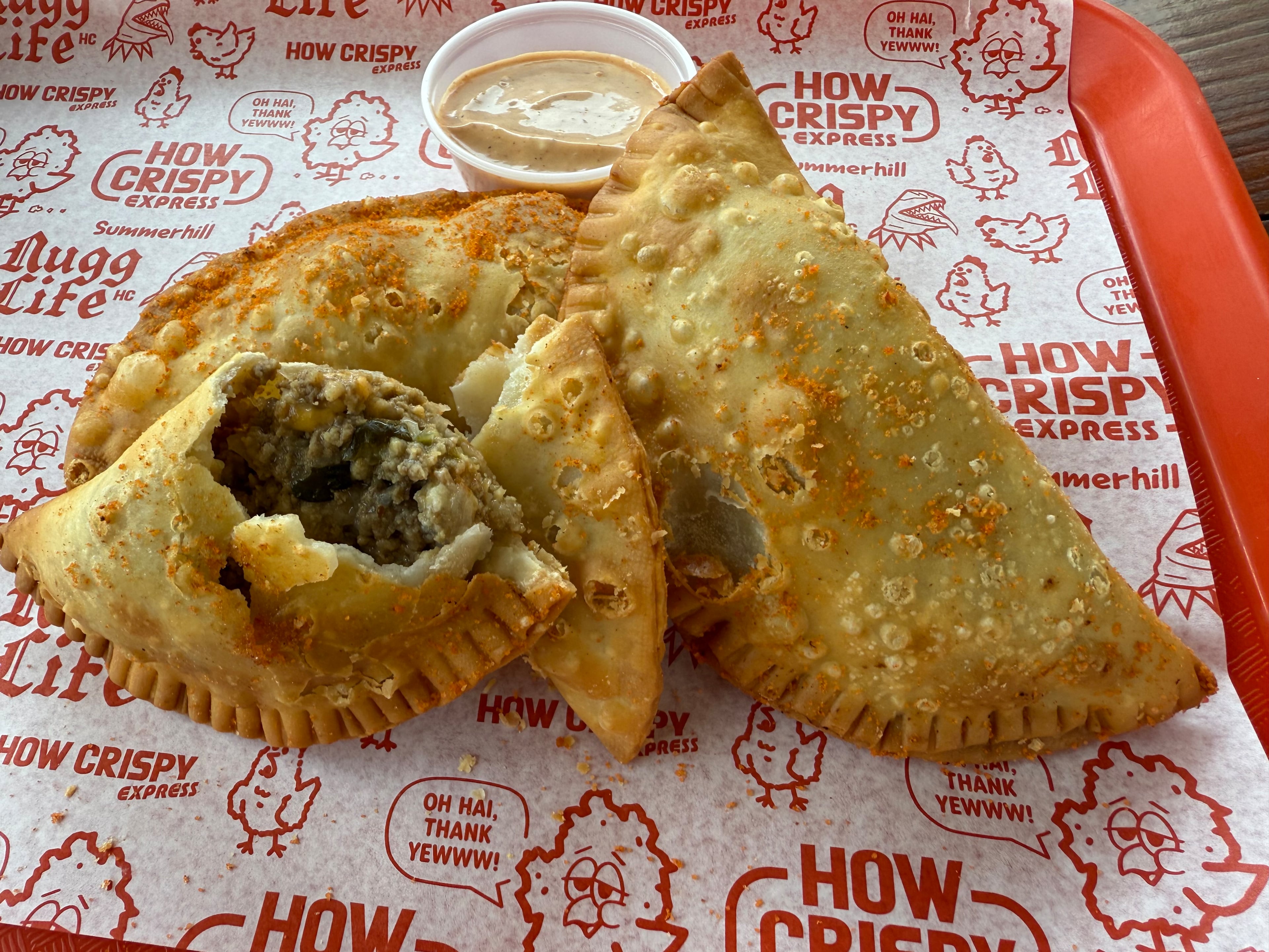 Patty melt empanadas at How Crispy come in a "structurally sound, less messy and adorably delicious hot little packet." (Angela Hansberger for the AJC)
