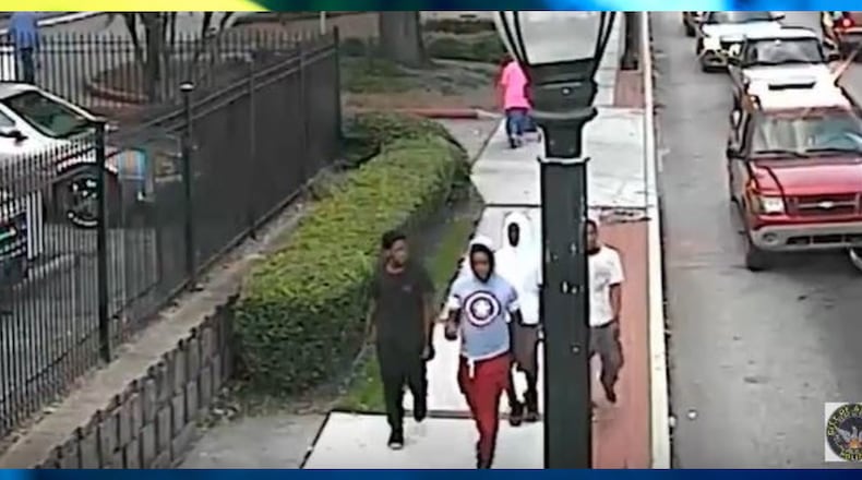 Atlanta police officers are looking for those pictured in this surveillance image in connection with a deadly carjacking. (Credit: Atlanta Police Department)
