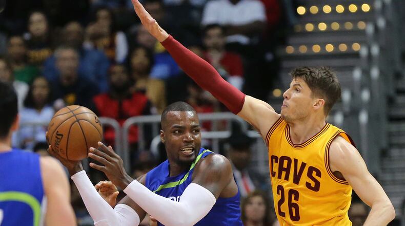 Hawks’ Paul Millsap is defended by former teammate Cavaliers’ Kyle Korver during the first half in a NBA basketball game at Philips Arena on Friday, March 3, 2017, in Atlanta. Curtis Compton/ccompton@ajc.com